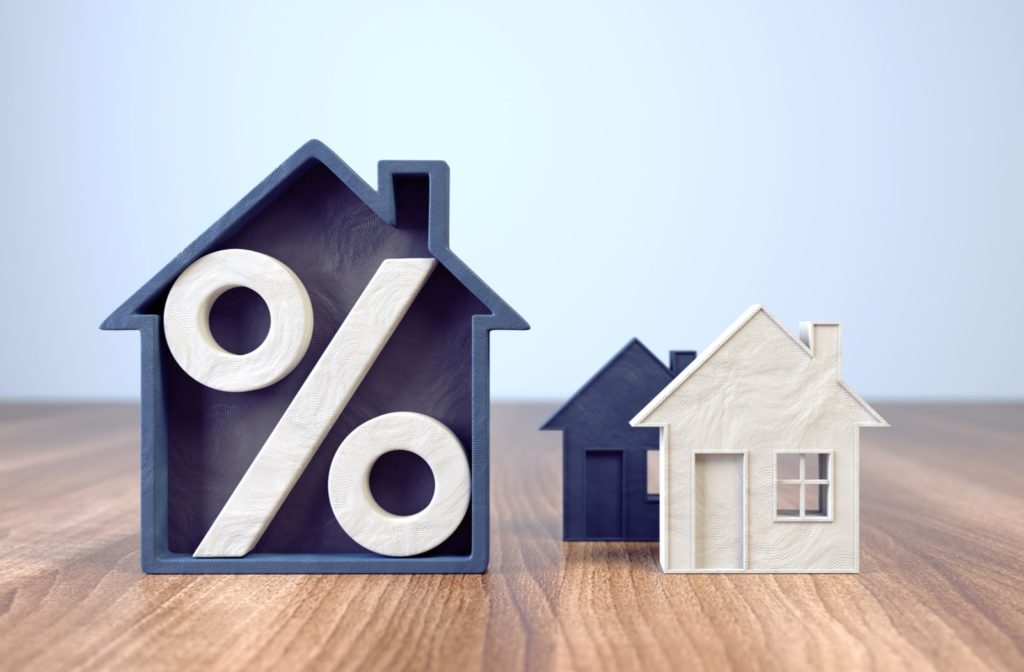 An illustration of a house with a percentage sign inside highlighting mortgage rate