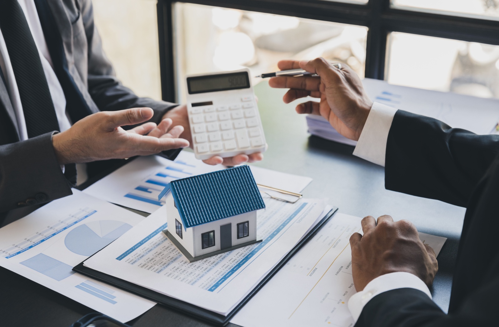 A lender and business owner discussing a company's residential mortgage terms.