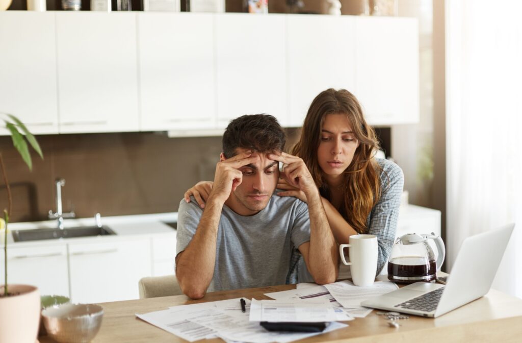 A young couple feels the financial burden and stress of missing multiple mortgage payments.