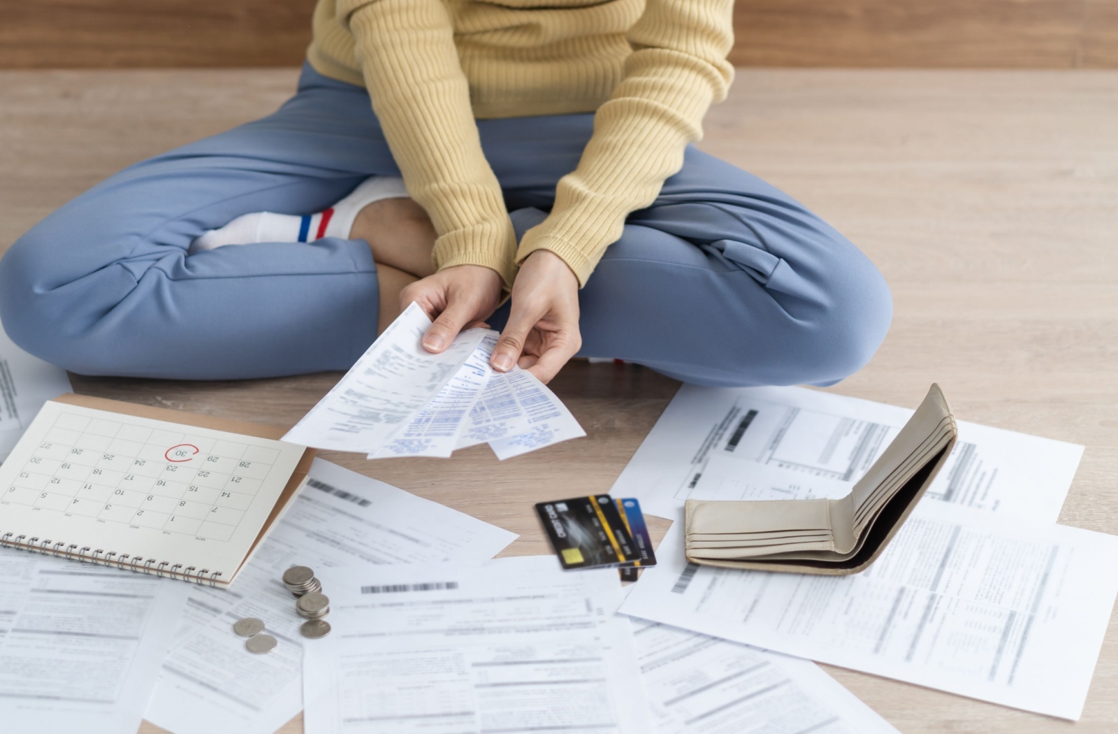 A person evaluates their finances in response to a denied mortgage renewal.