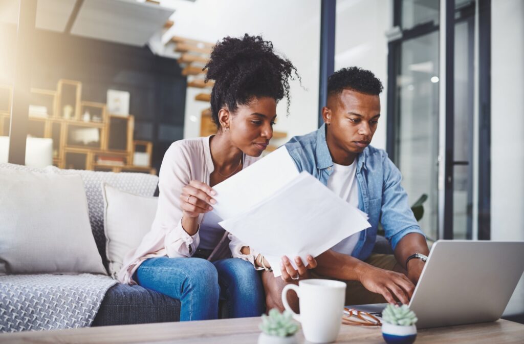 A couple reviewing their mortgage renewal papers.