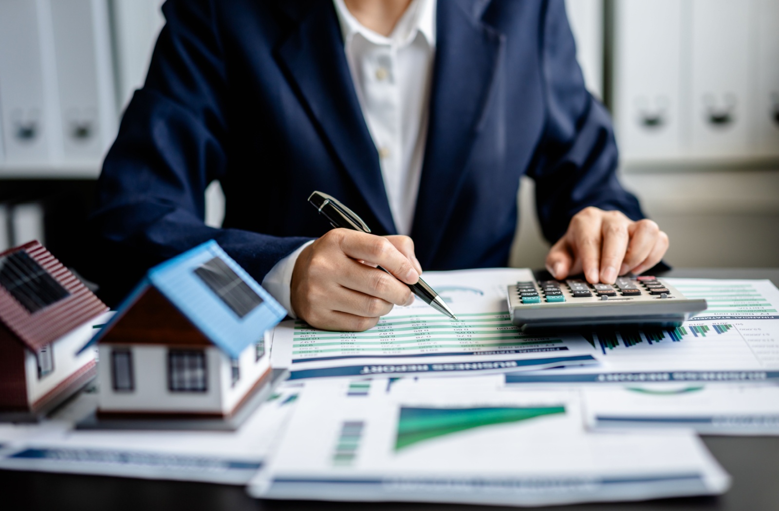 A mortgage broker working at a desk.