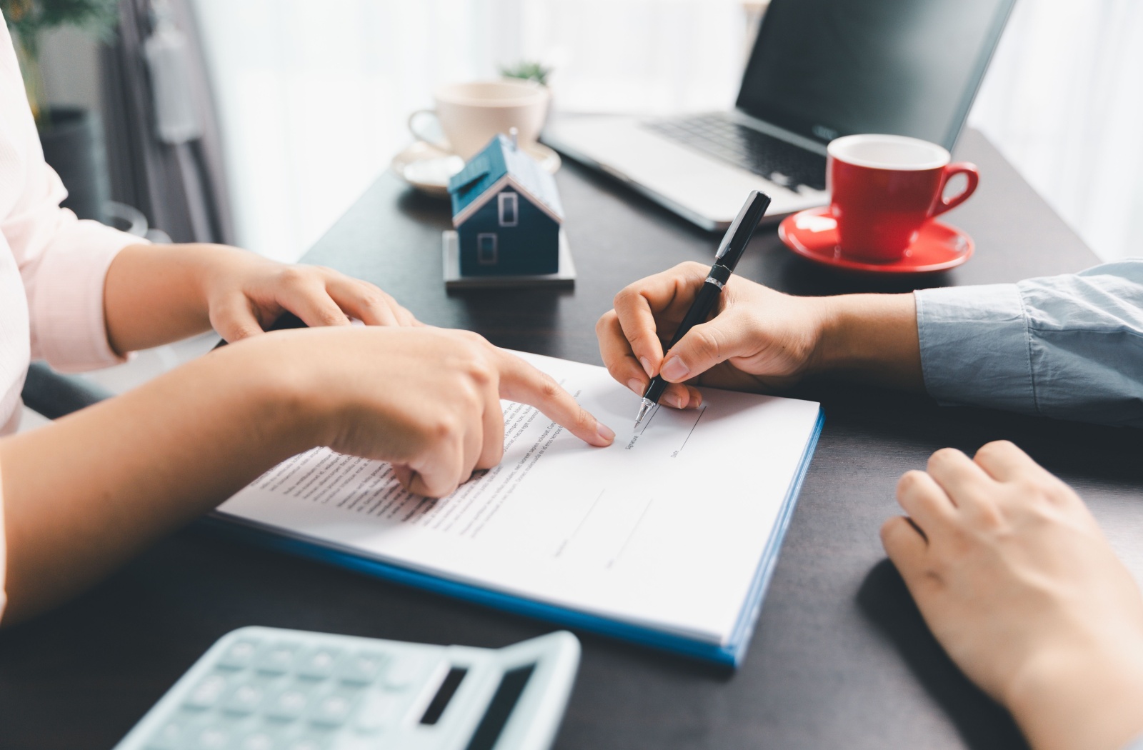 A mortgage broker explaining mortgage principal to a client.